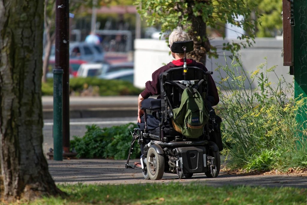 A participant out in his power wheelchair